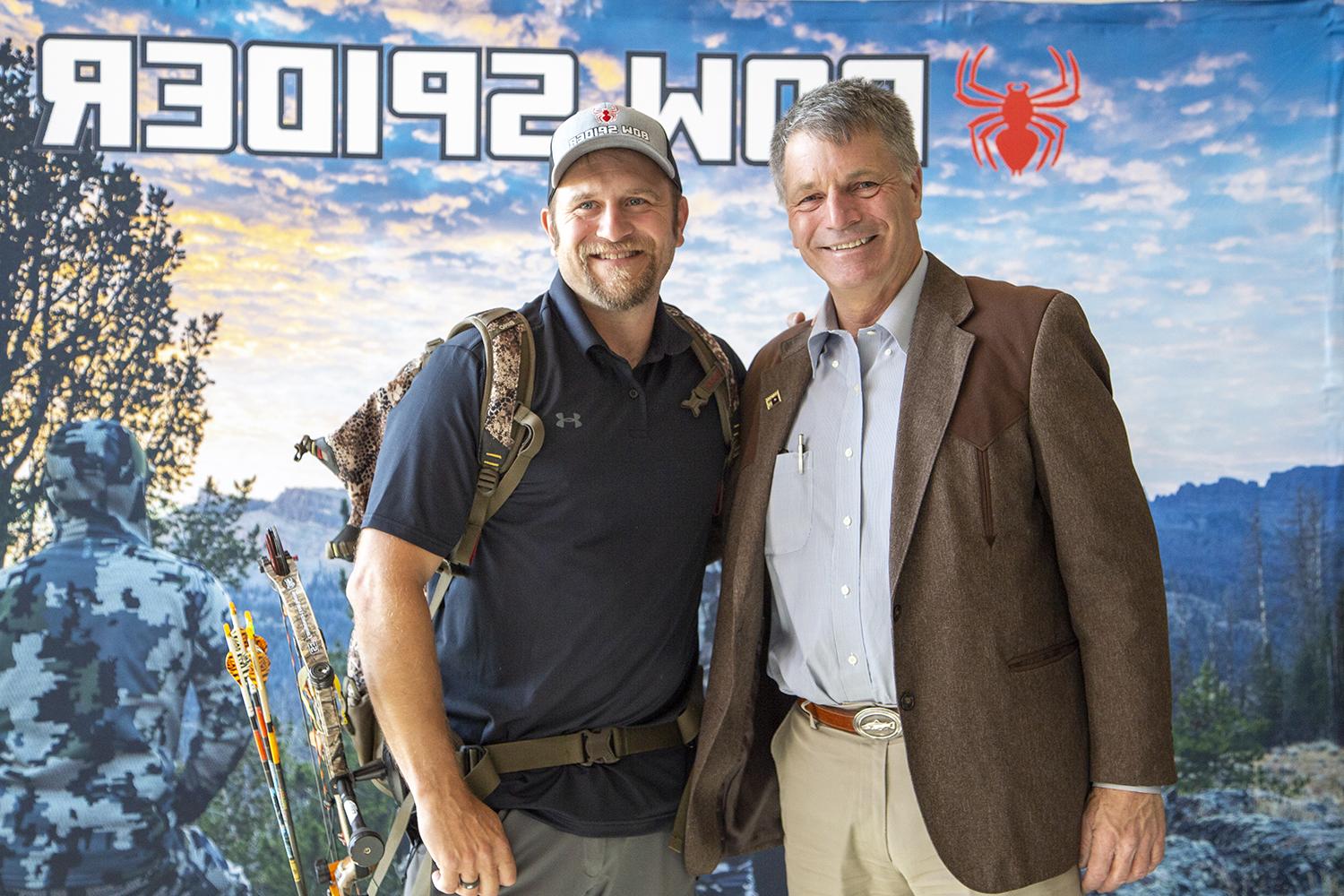 Governor Gordon stands with CWC graduate David Merrill for a photo